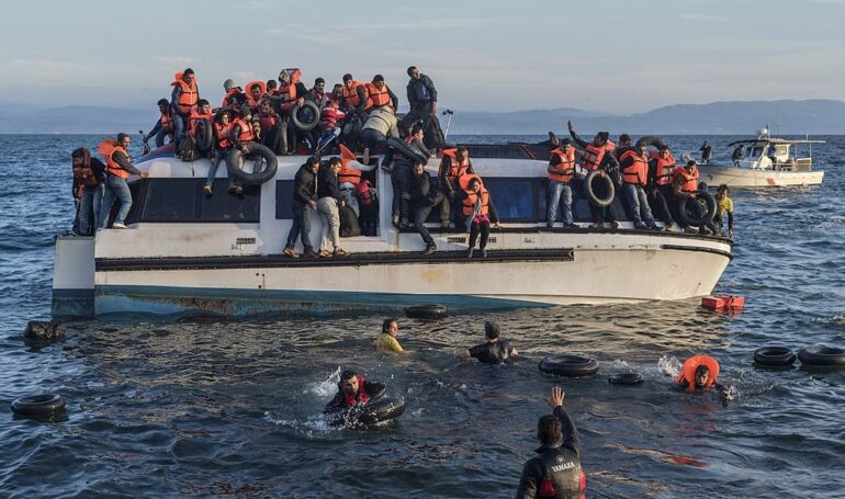Syrians and Iraqis Arrive in Lesvos, Greece photo by Ggia from Wikimedia Commons)