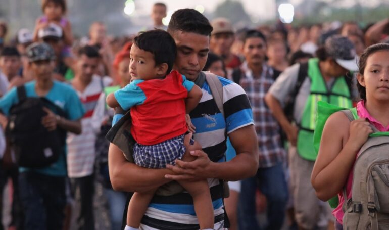 Caption: Migrant caravan crosses into Mexico, photo by John Moore, Getty Images